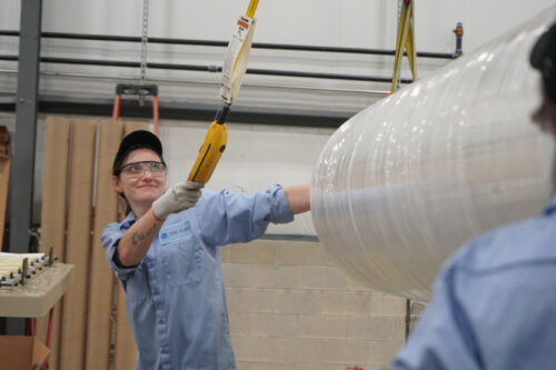 Person holding Encapsulant material from H.B. Fuller.